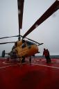Kamov helicopter sits ready to lift the team and equipment to Bouvet as soon as the rain stops